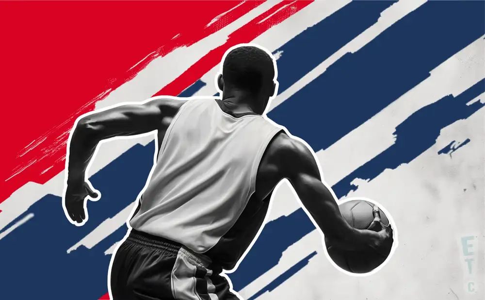 a los angeles clippers basketball player looks down the court with a basketball in his hand